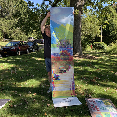Bill Pricket holding up his banner of the great swamp board work with color separations