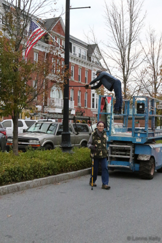 Amy R. Farrell on hand to participate in banner hanging, Daniel hanging banners