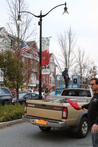Pawling Mayor Rob Lifflan cautions traffic during banner hanging