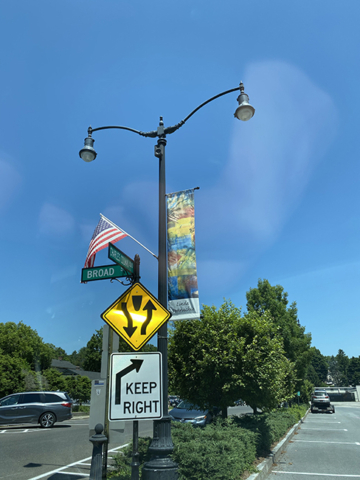 LInda Pennaccio Banner with village streets and traffic signs