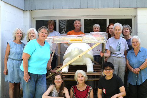 Fiberglas turtle delivered to Pawling artists gather around