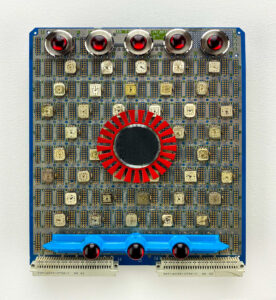 wall sculpture; Upcycled circuit board, with watches, red gear and other COOL Stuff