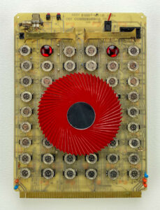 wall sculpture; Upcycled circuit board, with watches, red gear and other COOL Stuff