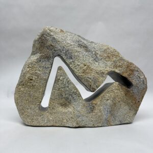Brown soapstone with a jagged opening mimicking a stock market chart