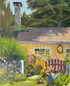 Yellow house with stone chimney, in front of which is flower garden, gate and watering bucket.