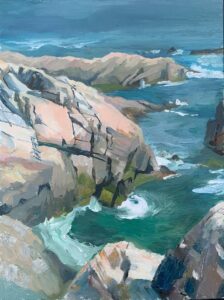 Rocky shoreline with crashing waves, distant spit of land visible.