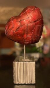 15 x 11-inch Patchwork Heart on square base. The heart has a red finish and the base is polished stee